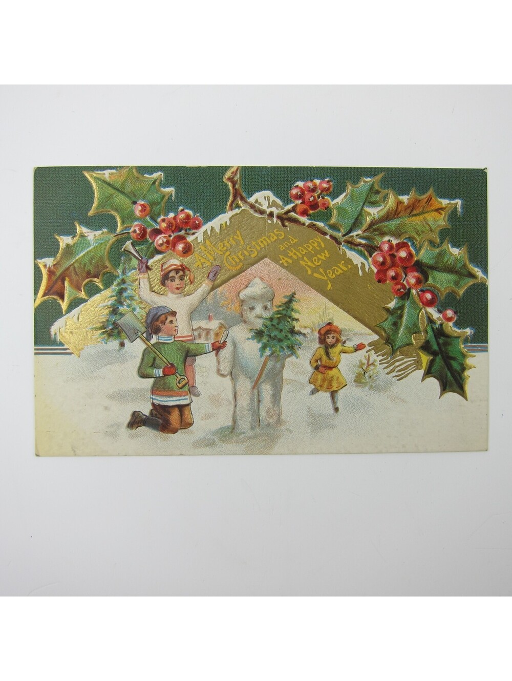 Christmas Postcard Children Build Snowman Holly Berries Gold Embossed Antique